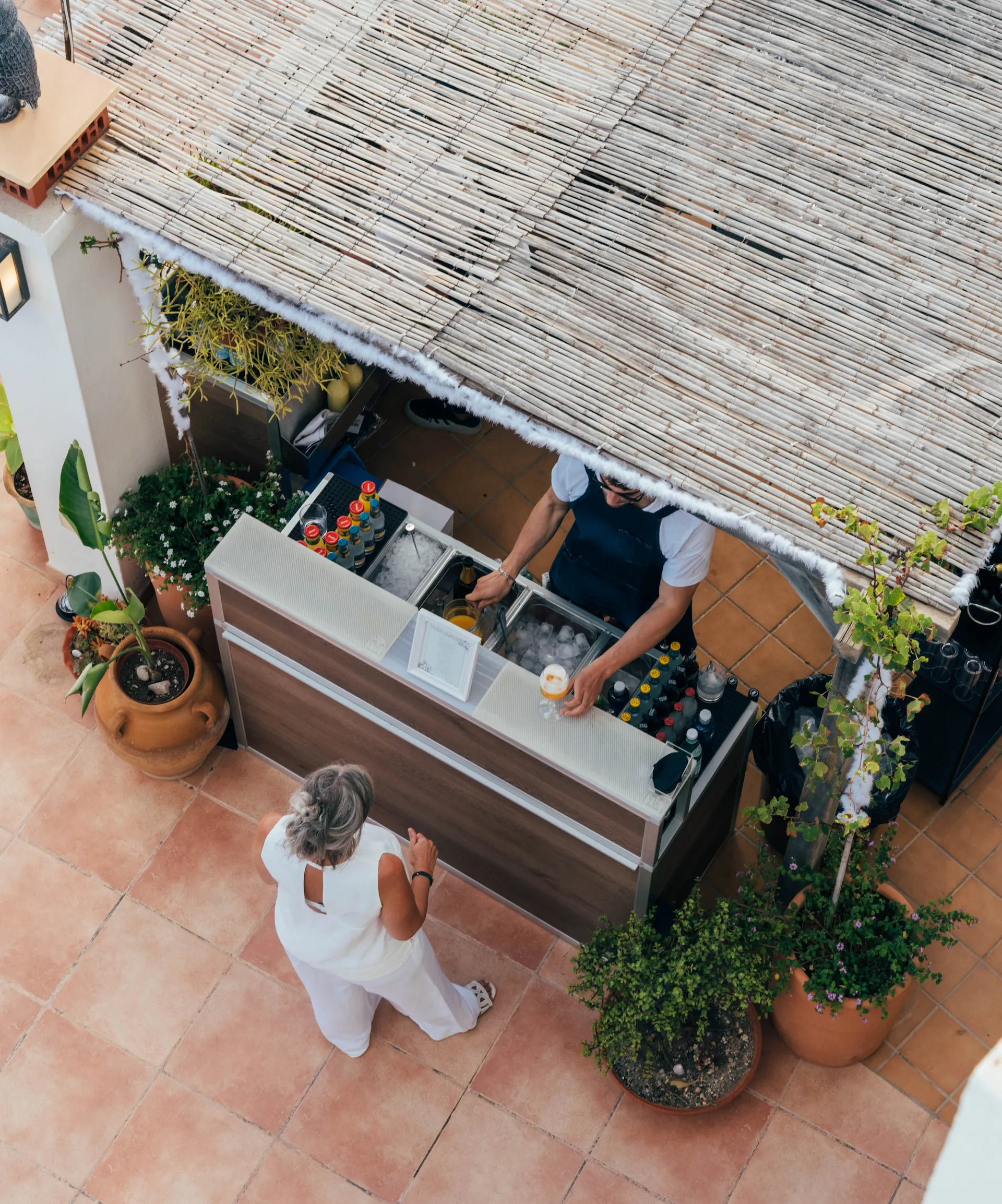 Professional bar setup at private event in Ibiza — signature cocktails and full bar team